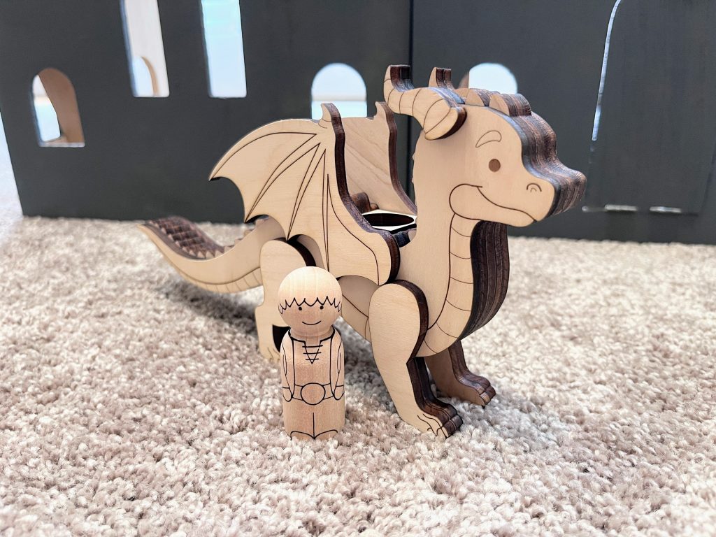 Dragon and rider peg doll set with dragon and rider standing next to each other
