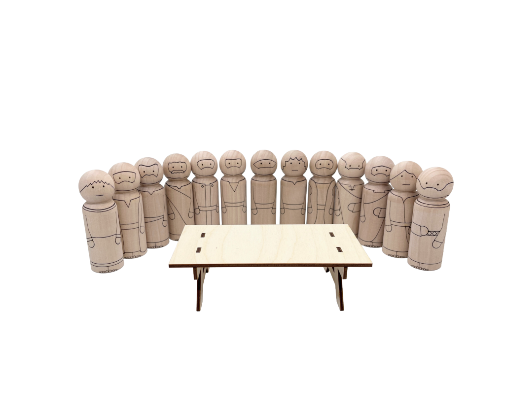12 disciples and Jesus as peg dolls behind a wood table
